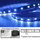 Close-up of blue RGB LED strip on reel with Wi‑Fi controller and cuttable design