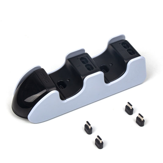 DualSense controller charging dock with two slots and included charging port covers.