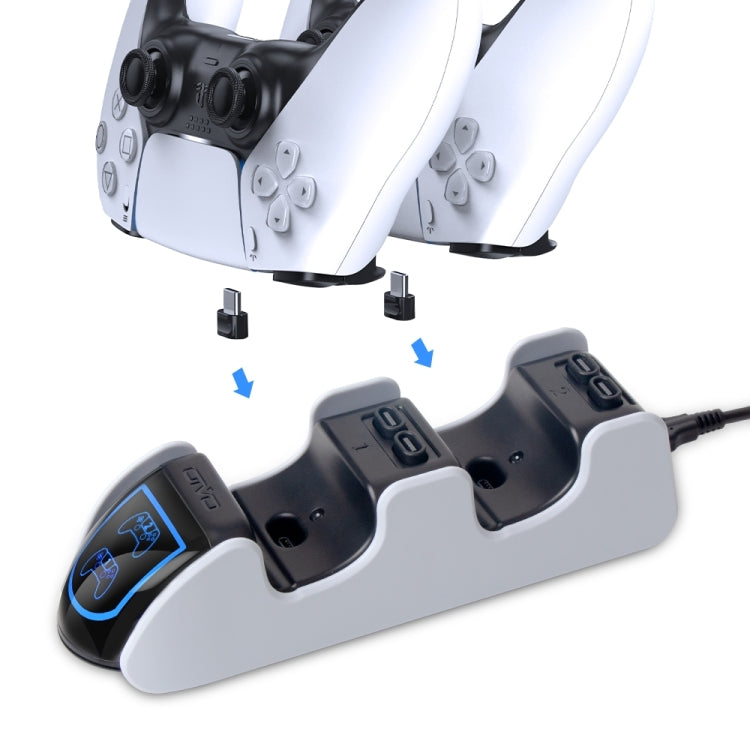 White dual PS5 charging dock showing controller placement and contact slots.