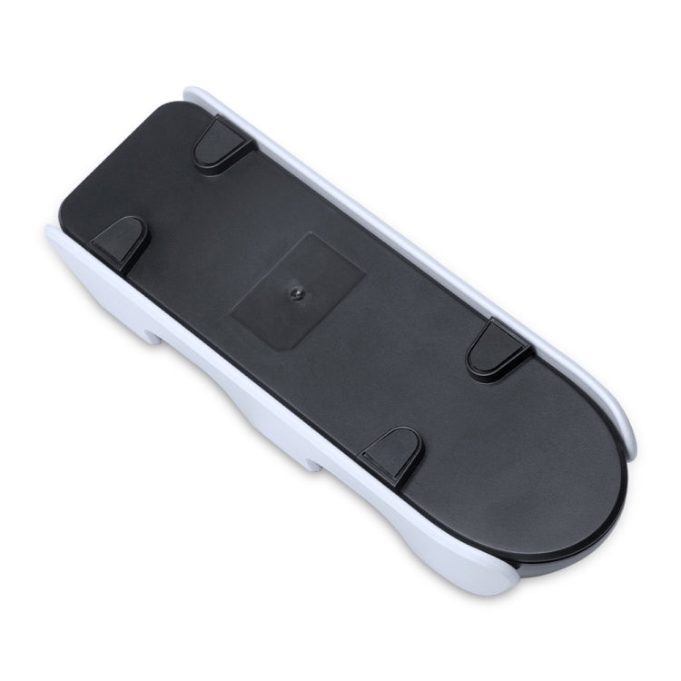 Underside of dual charging dock with mounting feet and power connection panel.
