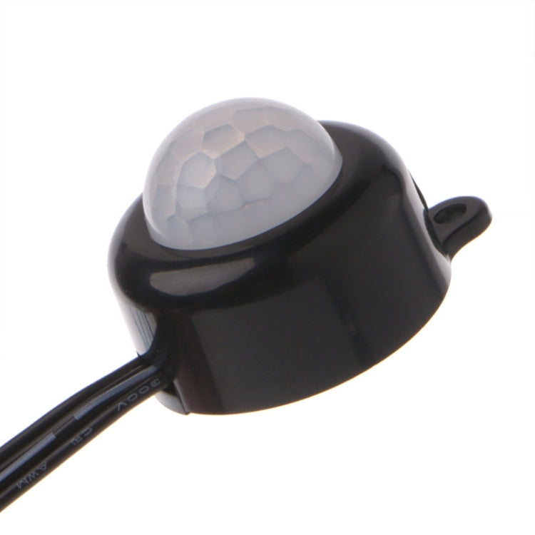 Black PIR motion sensor with textured lens cover and mounting tab