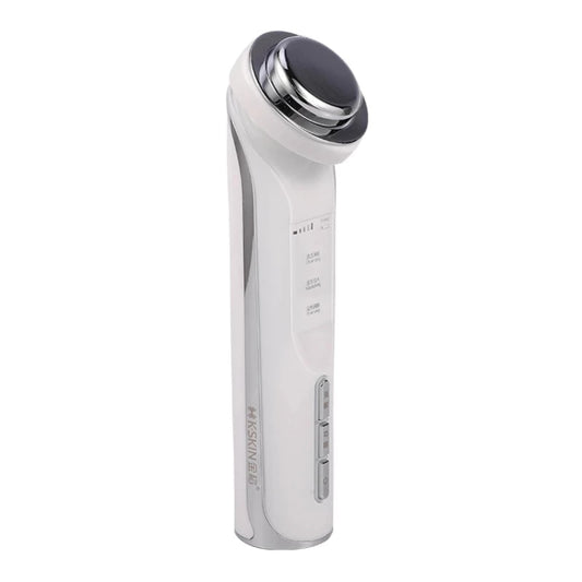 White facial cleansing massager with chrome top, side with control panel