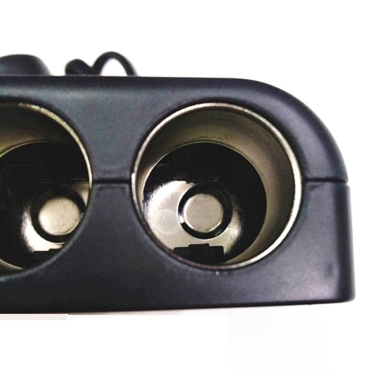 Dual cigarette-lighter sockets adapter, close-up of two socket openings