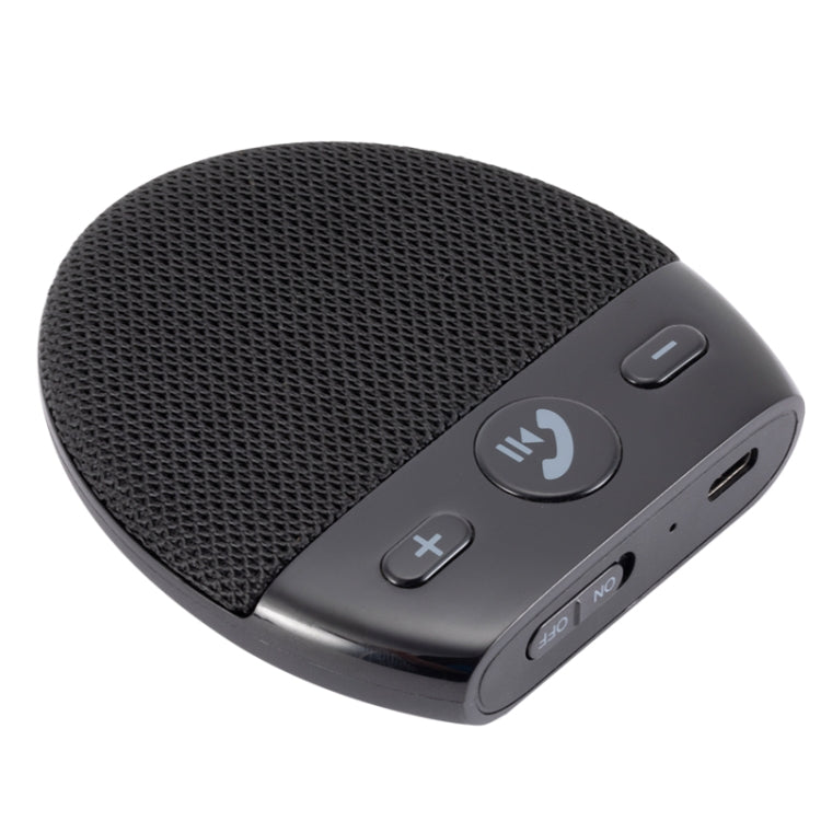 Black handsfree speaker with mesh surface, call button, and USB port panel