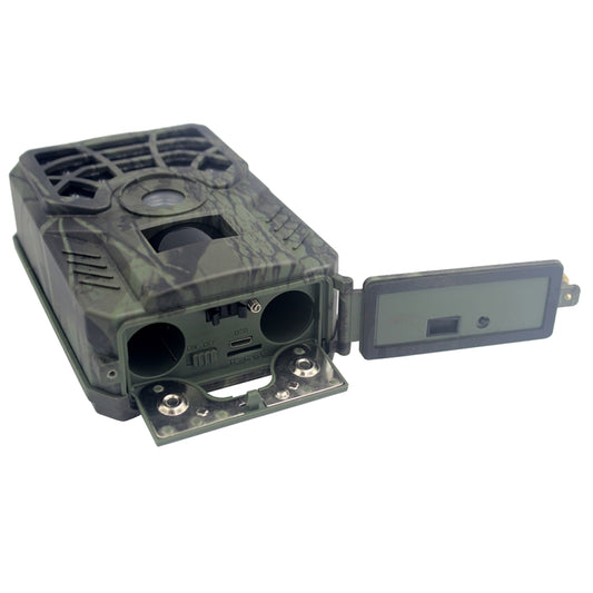 Camouflage trail hunting camera with open battery area and attached LCD screen