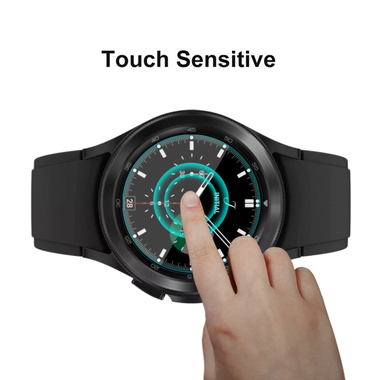 Black smartwatch with touch-enabled screen protector overlay and finger tapping the display