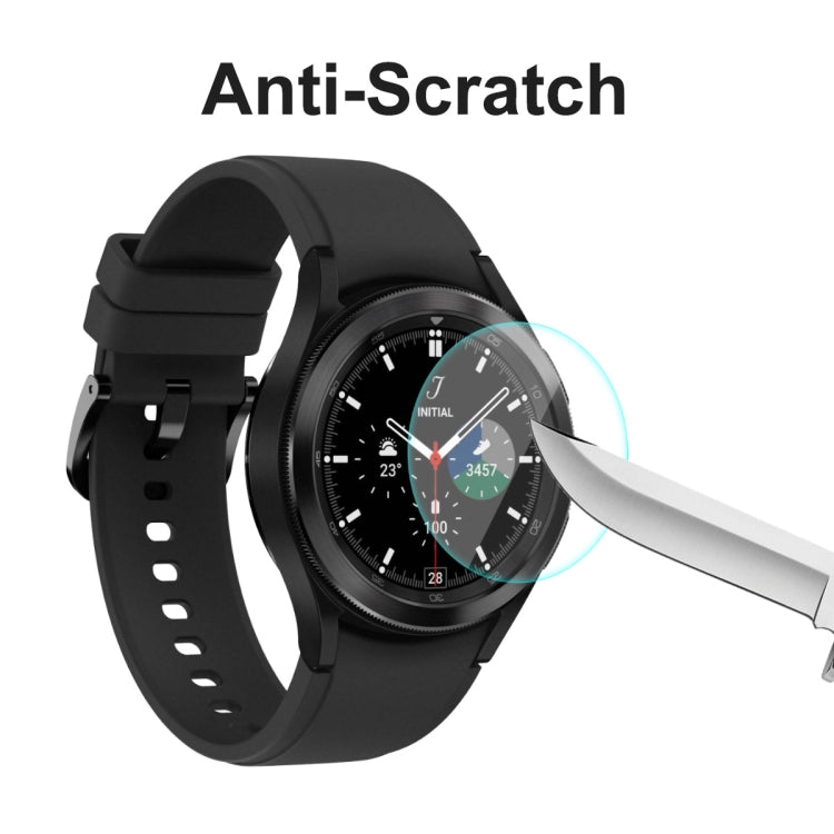 Black smartwatch with anti-scratch screen protector and stylus scraping over glass