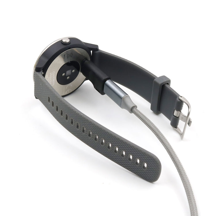Black watch charging cradle on silicone strap with braided cable and plug