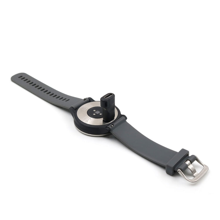 Black watch charging cradle with silicone strap and metal buckle