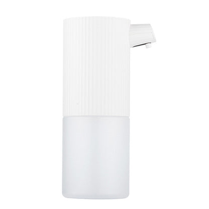 Automatic foam soap dispenser with ribbed white top and curved pump nozzle