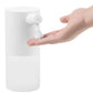 Automatic foam soap dispenser dispensing foam, shown with hand under the nozzle