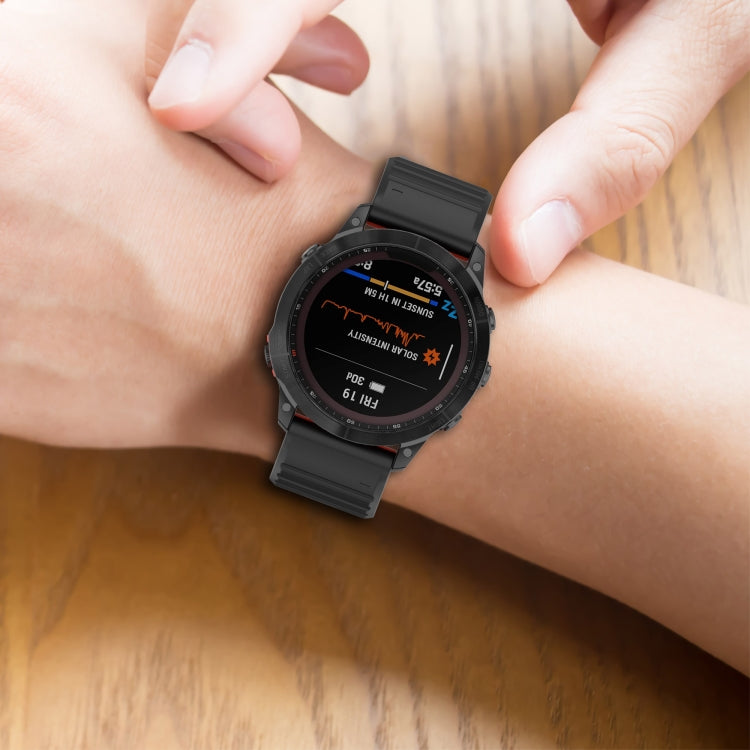 Black silicone watch strap worn on wrist with matte texture