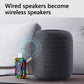 Bluetooth audio adapter connected to a dark gray portable speaker with multicolor LEDs