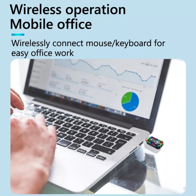 Bluetooth audio adapter connected near a laptop keyboard with multicolor LED panel