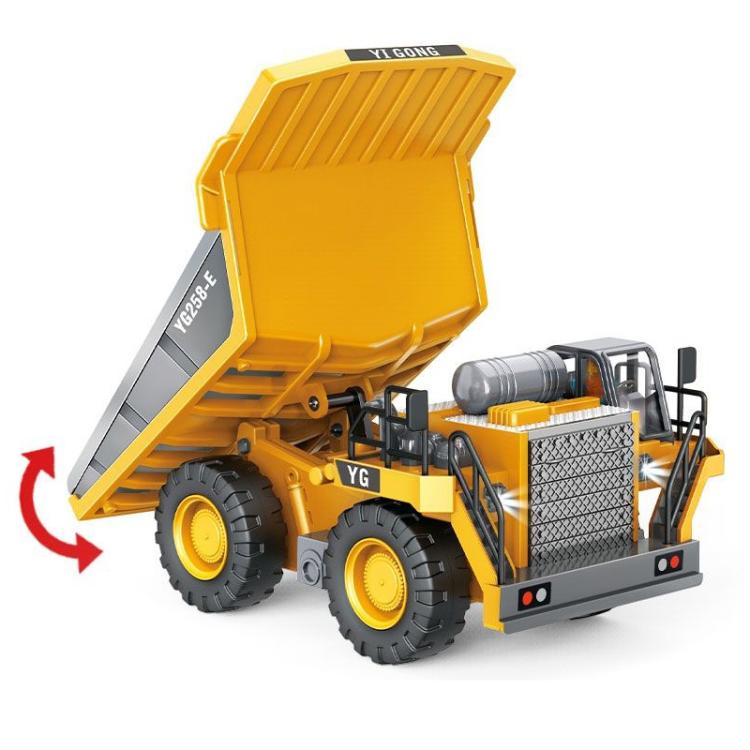 Yellow and gray remote dump truck with raised tipper bed and front winch details