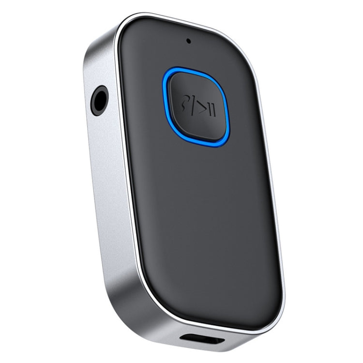 Bluetooth audio adapter with blue-ring control, dark front and visible side button area