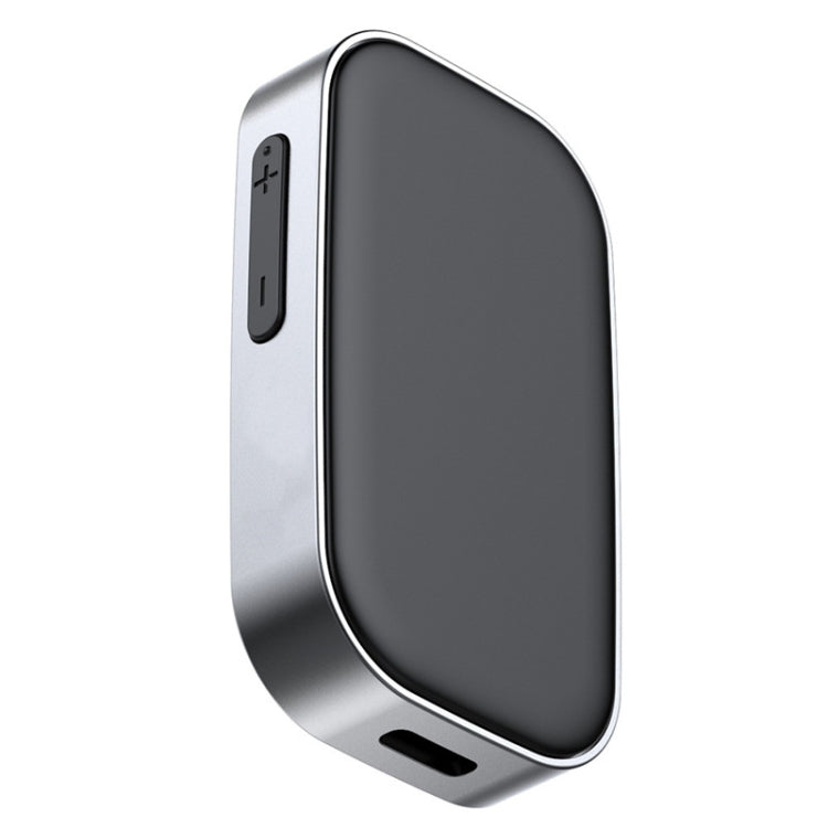 Bluetooth audio adapter with AUX and charging ports, dark case and blue-ring button