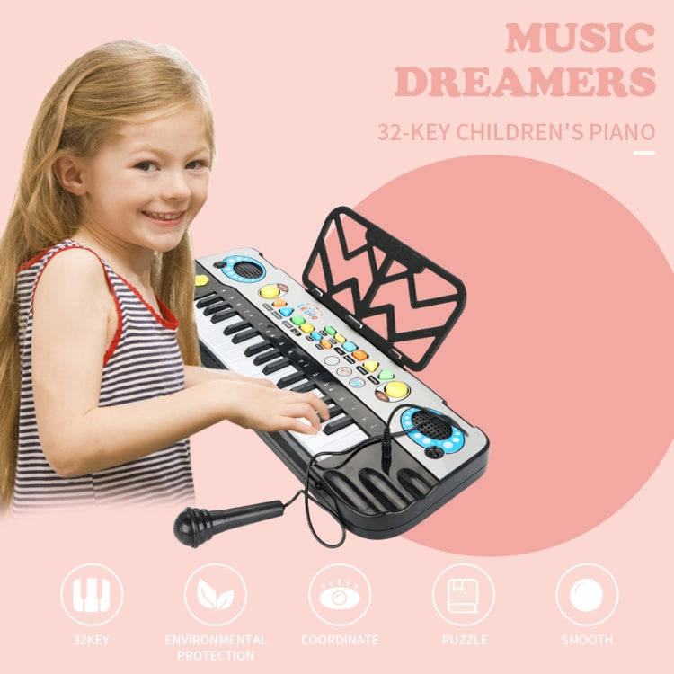 Child playing a 32-key electronic keyboard with colorful buttons and speaker pads