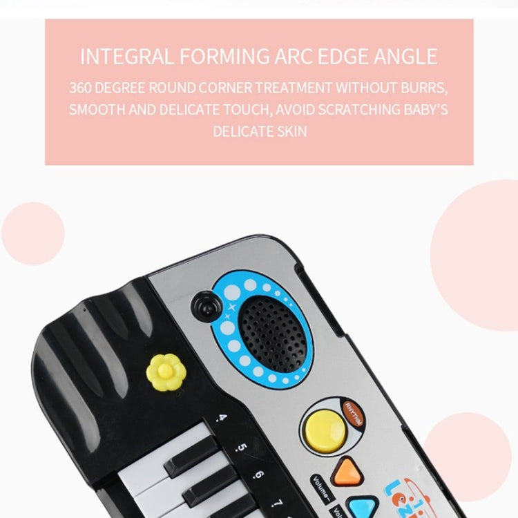 Close-up of children’s electronic keyboard control area with blue speaker pad and buttons
