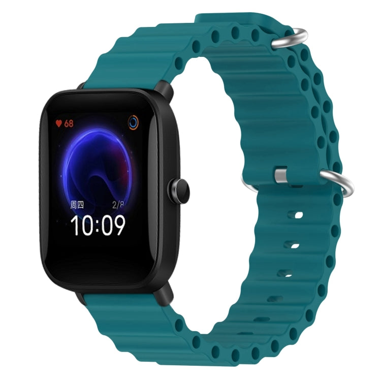 Teal silicone watch band with perforated links and metal pin clasp
