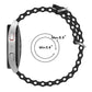 Black perforated silicone watch band with metal buckle; adjustable size range marked