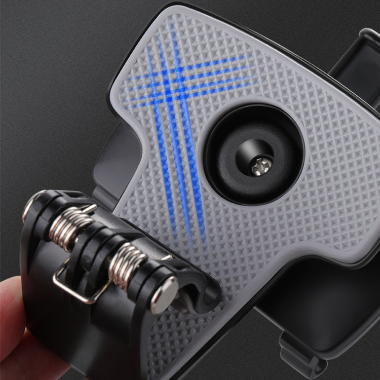 Close-up of textured grip pad and metal screw on black phone holder