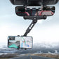 Rearview mirror phone holder mounted in car, with phone cradled for navigation, dark gray