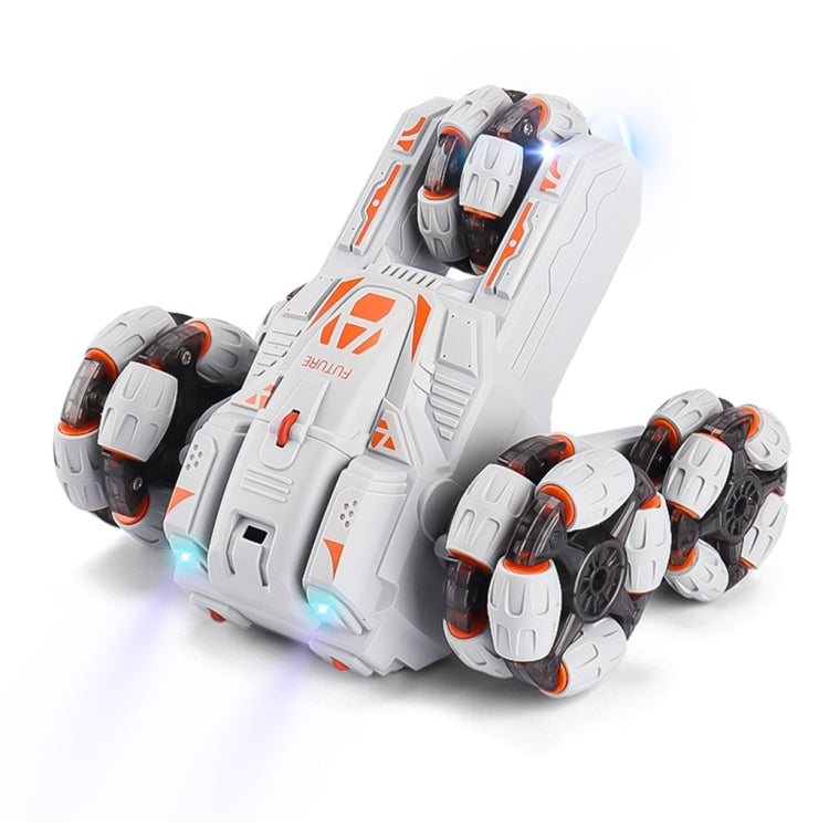 White five-wheeled RC stunt car with orange decals and glowing front LEDs