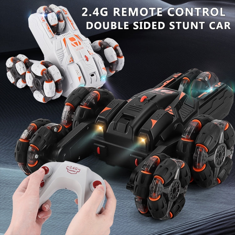 White and black RC stunt cars with remote control and hands, double-sided view