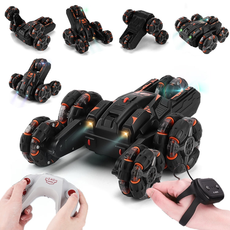 Black RC stunt car with orange accents shown with remote control and hands