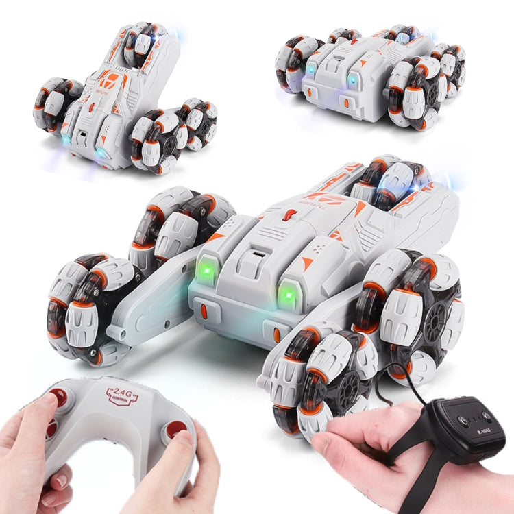 White RC stunt car with orange decals shown with hands using a gamepad remote