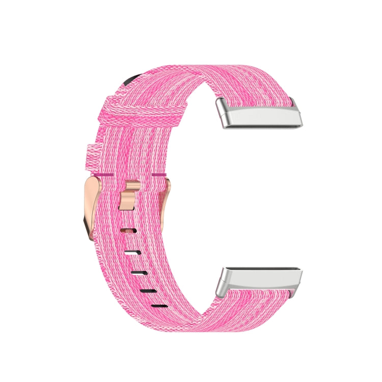 Pink nylon weave watch band with metal clasp and adjustable holes, close-up