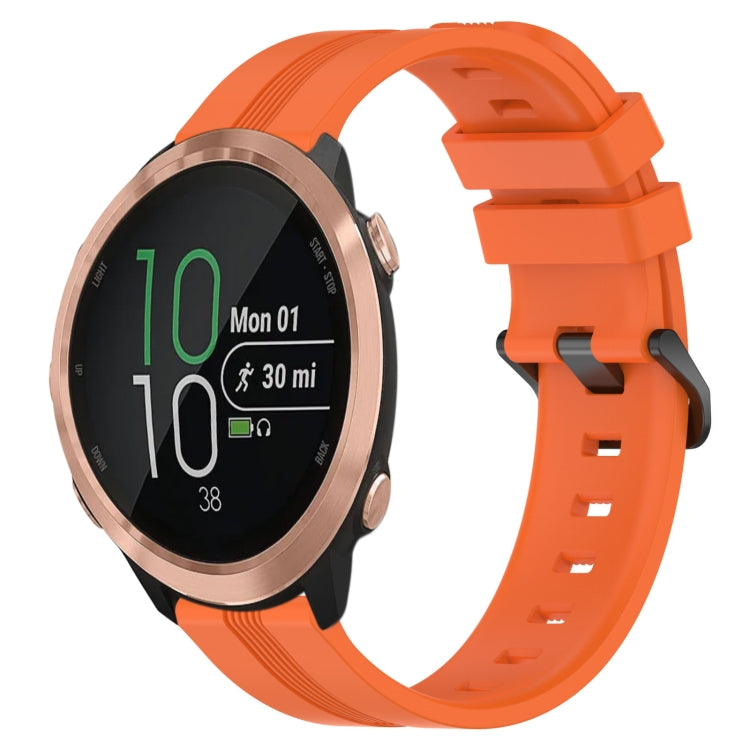 Orange silicone watch band with concave striped texture and buckle clasp