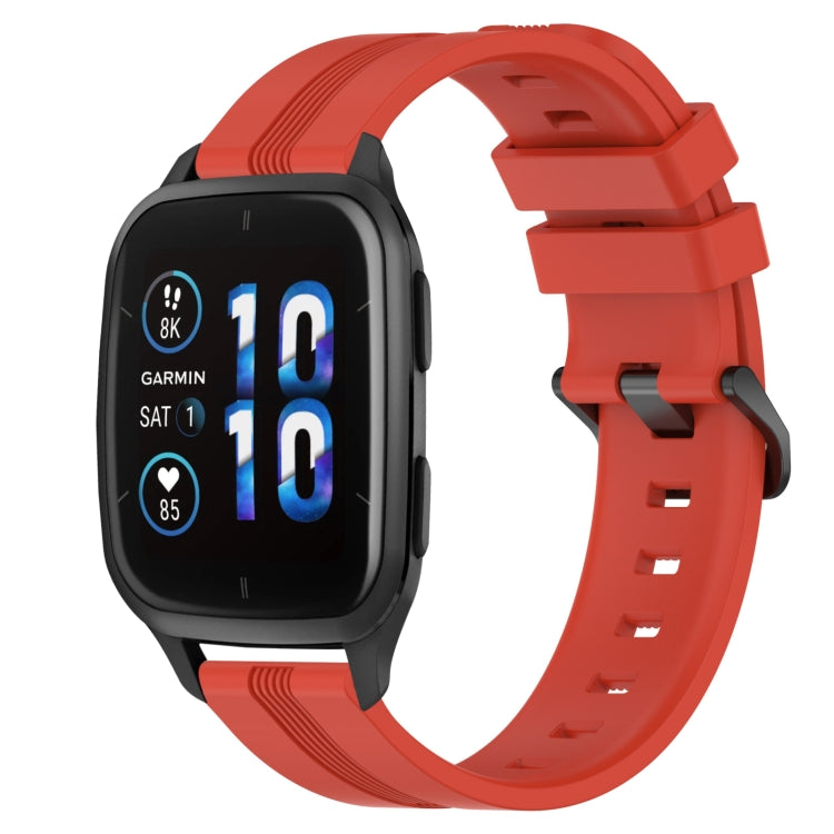 Concave striped silicone watch band in red with buckle, worn on a black smartwatch