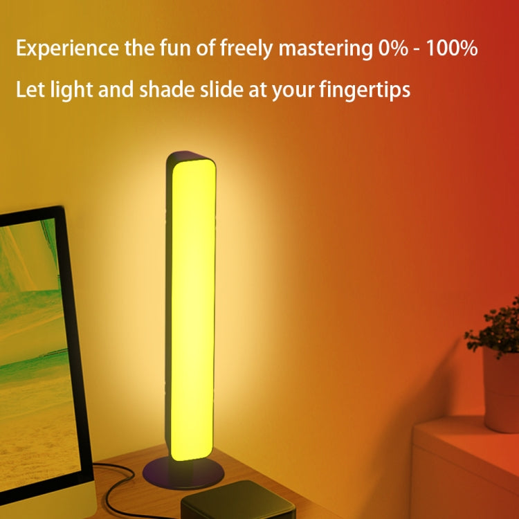 Standing RGB light bar with yellow glow, base, and visible power cable