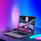 RGB light bar with pink glow next to laptop on desk