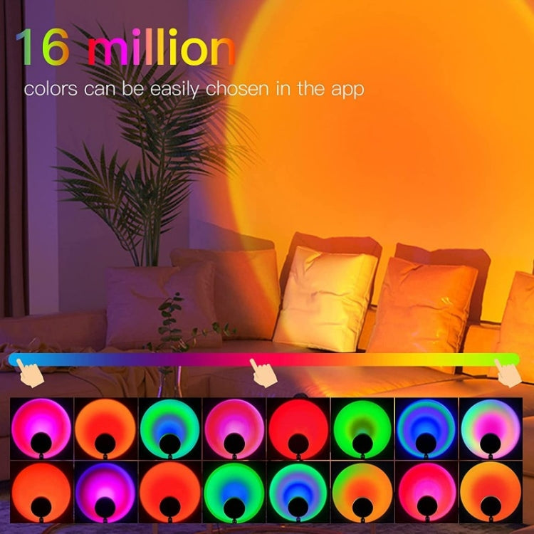 RGB sunset projector lamp casting rainbow light patterns across a living room sofa area