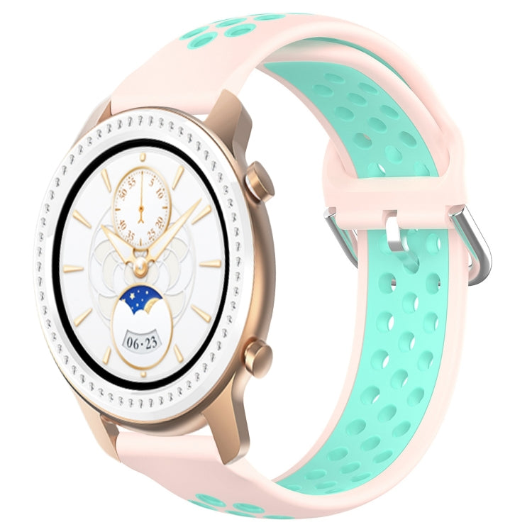 Light pink perforated silicone watch band with turquoise inner panel and metal buckle