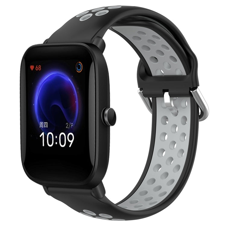 Perforated silicone sports watch band with black strap and dark gray perforations, watch shown