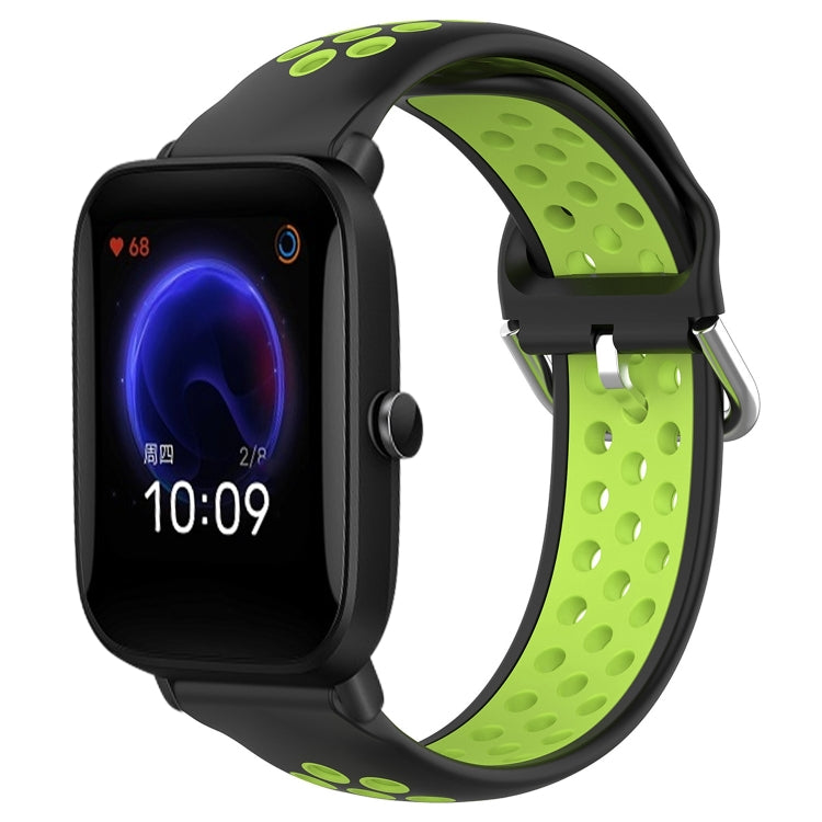 Perforated silicone sports watch band with black strap and lime green perforations, watch shown