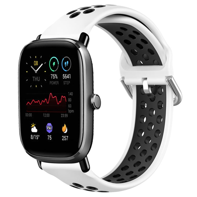 Perforated breathable silicone watch band with white strap and black perforations, smartwatch