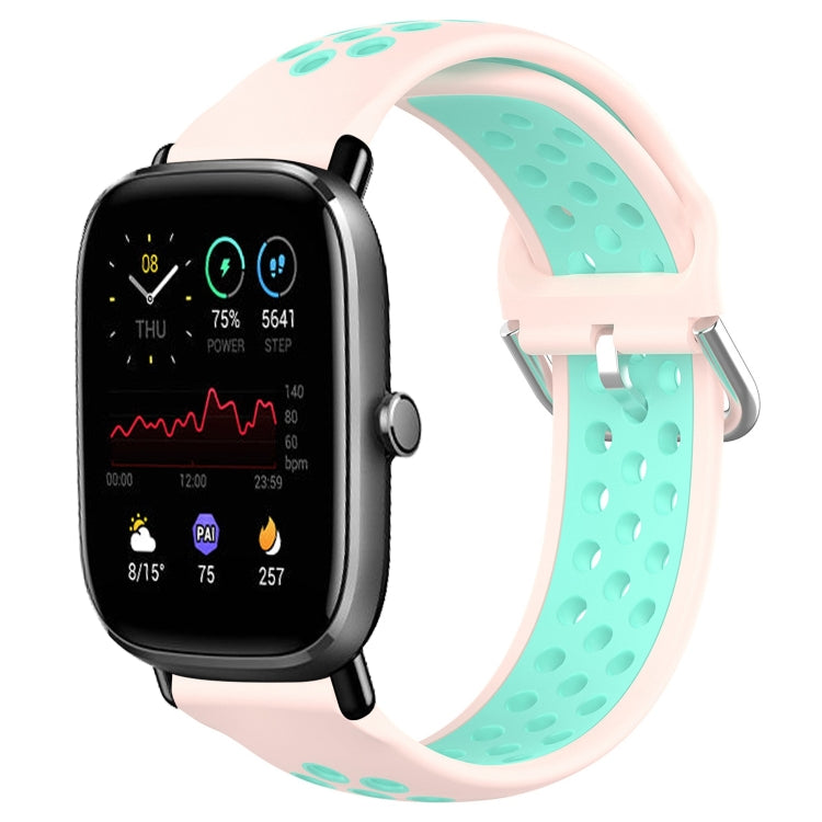 Perforated breathable silicone watch band with pale pink and teal strap, black smartwatch