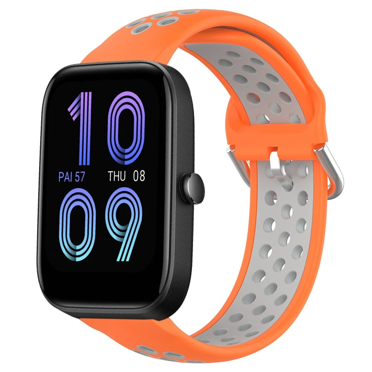 Orange perforated silicone sports watch band with gray strap underside and metal buckle.