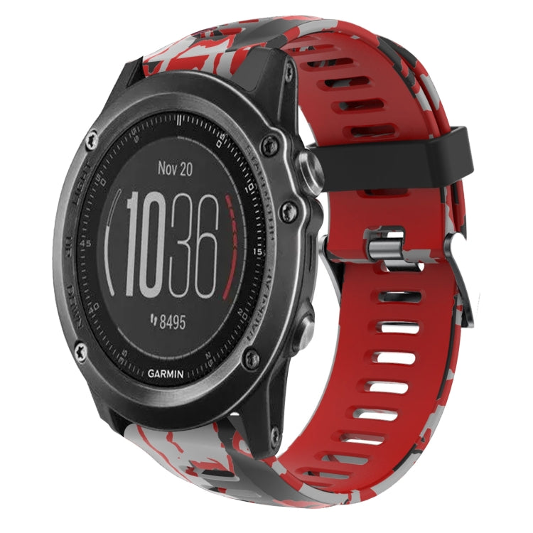 Camouflage silicone watch band with red and gray splatter print, perforated strap