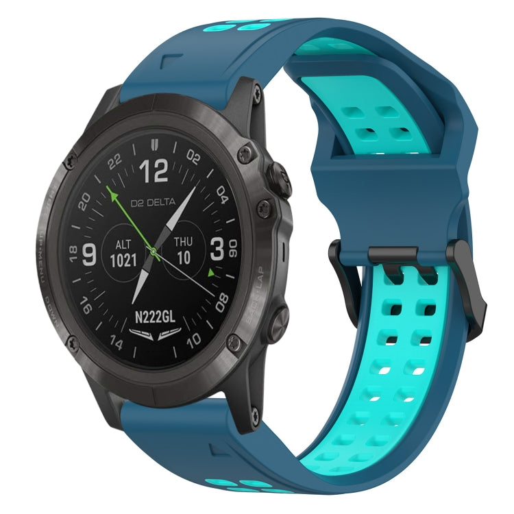 Two-tone silicone watch band in teal and black, with perforated strap holes