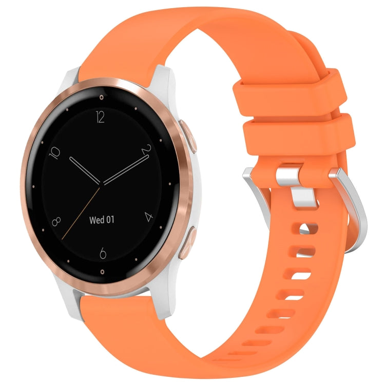 Glossy silicone watch band in orange with silver buckle and adjustable clasp