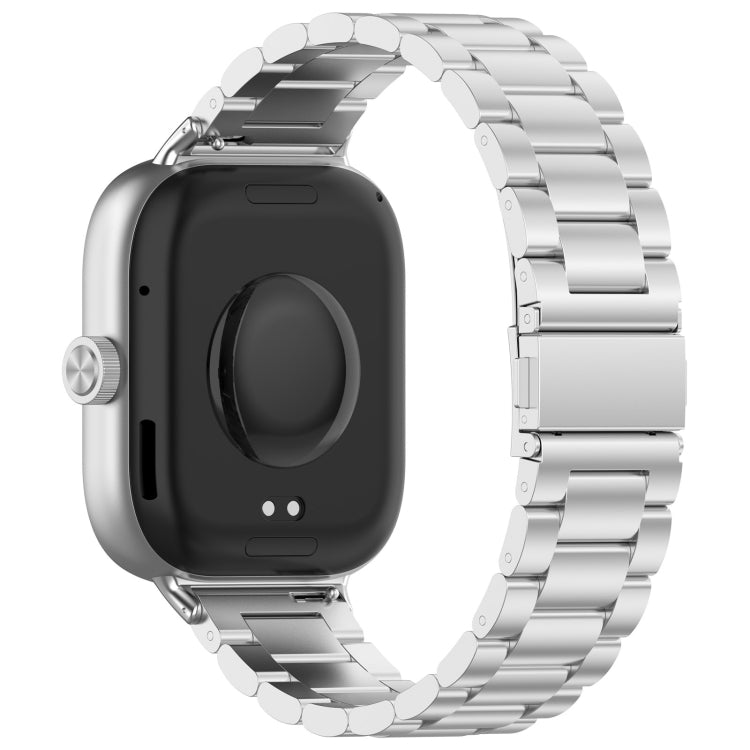 Silver three-bead stainless steel watch band fitted to a smartwatch, rear view