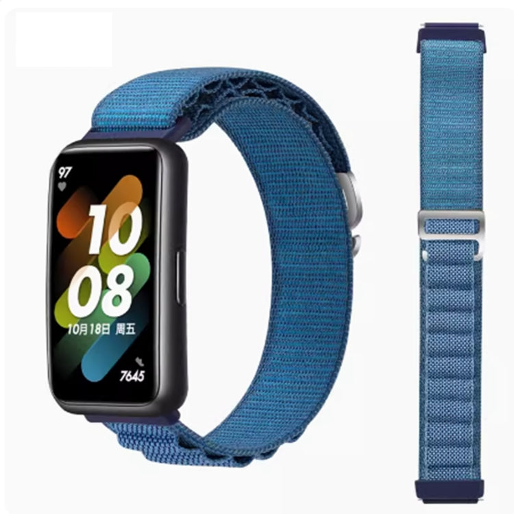 Blue nylon loop watch band shown fitted and laid flat beside the watch.