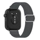 Back view of a dark gray elastic nylon watch band with metal loop and smartwatch.