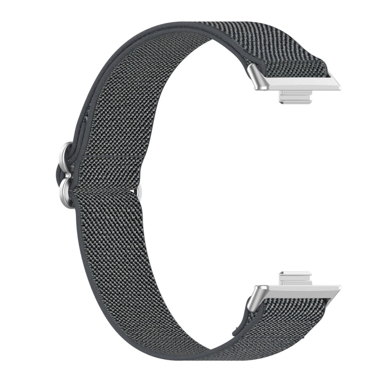 Dark gray elastic nylon watch band with exposed watch connectors.